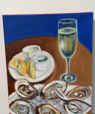 Oysters and Champagne by Andrea Bello, an oil painting of oysters, condiments, and a glass of champagne on a blue and brown ground.