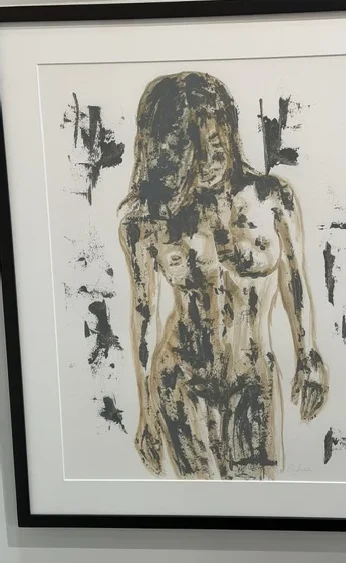 Presence by Andrea Bello, a framed acrylic and watercolor figure rendered in black, ochre, and grey on paper.